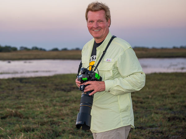 Harry Martin with a telephoto camera in the Okavango Delta, 2014